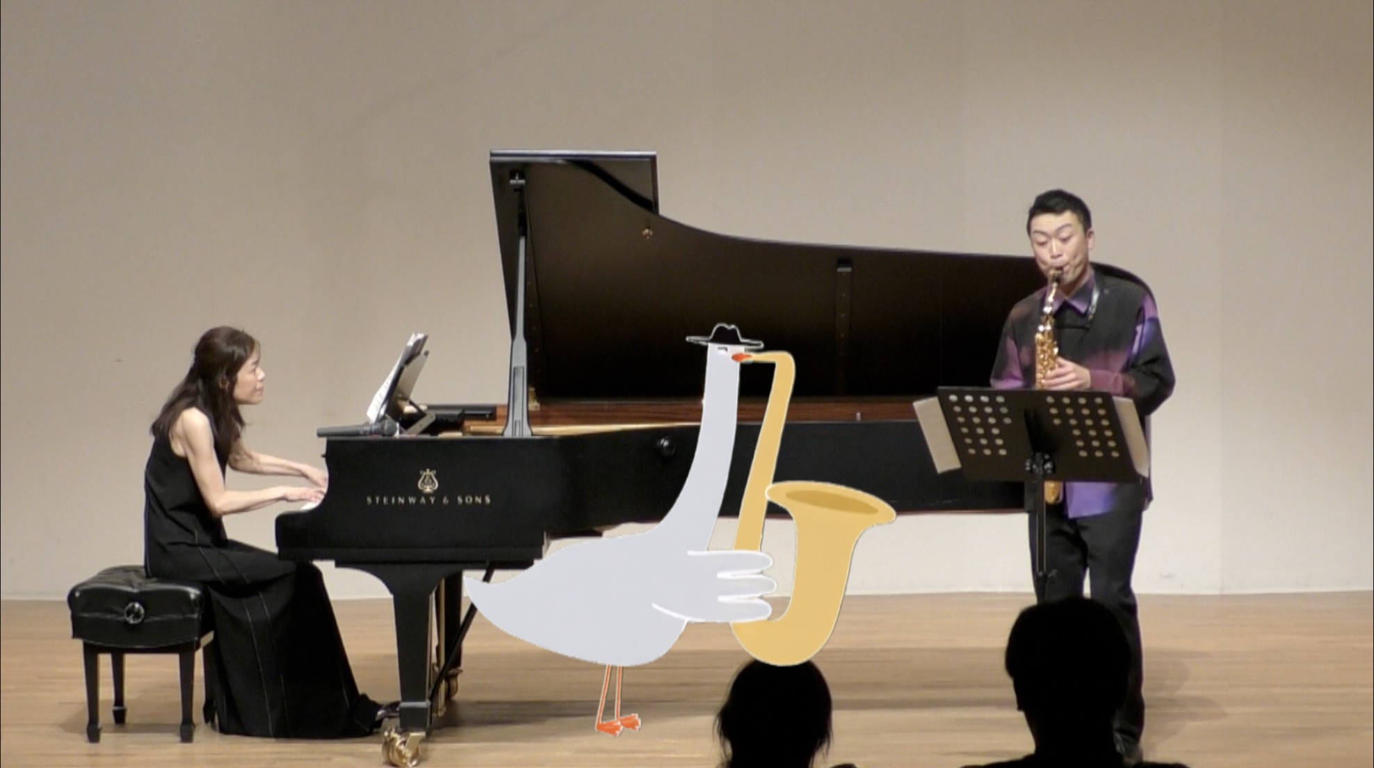 「一時間のクラシック」の会YouTubeより「サキソフォビア Saxophobia」 ガチョウのイラストとの演奏カット